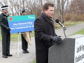 Then-deputy mayor Steve Desroches speaks during a special ceremony to commemorate the naming of Vimy Memorial Bridge, formerly the "Strandherd-Armstrong Bridge" in Ottawa on Nov. 8, 2014.