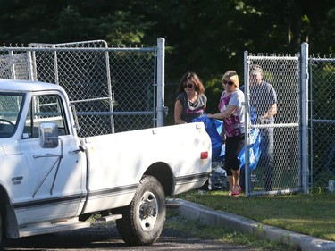 The remains of a dog that  didn't survive a fire is put in the truck to be taken away from the Aylmer SPCA July 03, 2018.  Photo by Jean Levac/Postmedia  129531