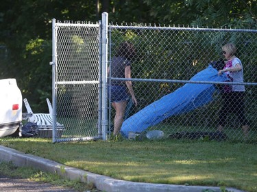 The remains of a dog that  didn't survive a fire is put in the truck to be taken away from the Aylmer SPCA July 03, 2018.  Photo by Jean Levac/Postmedia  129531