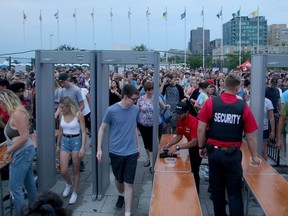 The lineups were thick and busy just before the main show of Bryan Adams on opening night of Bluesfest Thursday (July 5, 2018).