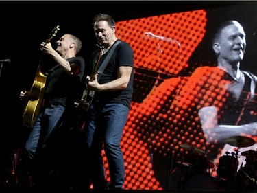 Bryan Adams (left, with his bass player) plays to a packed house on opening night of Bluesfest Thursday (July 5, 2018). Julie Oliver/Postmedia