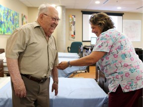 George Vuillard, a resident at the Perley and Rideau Veterans' Health Centre with PSW Valerie Little.