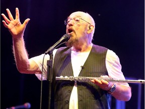 Ian Anderson, a founding member of the 50-year-old Jethro Tull, plays against a psychedelic backdrop of old TV footage on the main stage at RBC Ottawa Bluesfest on Friday night.  Julie Oliver/Postmedia