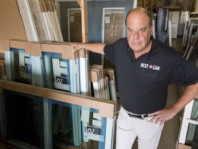 BestCan owner Brian Bailey in his warehouse full of stock for clients with contracts for efficient windows and plans for a rebate through GreenON. He and his staff are now scrambling to get the work done by a new government deadline this fall. June 27, 2018. Errol McGihon/Postmedia
