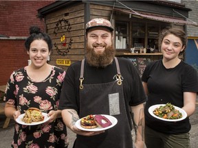 Chef Jeff Bradfield with his partner Sophie Malo (L) and cook Mikhaila Jade at their Fifth Dimension Snack Bar food truck on Bank Street in the Glebe. July 24, 2018. Errol McGihon/Postmedia