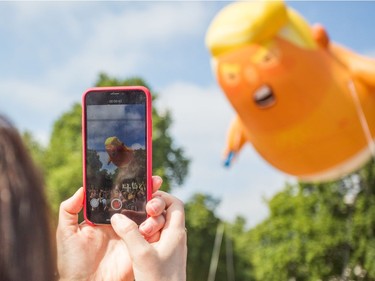 Protestors against the visit of US President Donald Trump fly a 20ft 'Baby Trump' blimp  depicting Donald Trump as a enraged, smartphone-clutching infant.  Featuring: Atmosphere, View Where: London, England, United Kingdom When: 13 Jul 2018 Credit: Wheatley/WENN ORG XMIT: wenn34911766