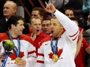 Patrick Marleau #11 and Jarome Iginla #12 of Canada celebrate after receiving the gold medals won during the ice hockey men's gold medal game between USA and Canada on day 17 of the Vancouver 2010 Winter Olympics at Canada Hockey Place on February 28, 2010 in Vancouver, Canada.