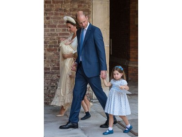 LONDON, ENGLAND - JULY 09: Prince William, Duke of Cambridge and Catherine, Duchess of Cambridge with their children Prince George, Princess Charlotte and Prince Louis after Prince Louis' christening at the Chapel Royal, St James's Palace, London on July 09, 2018 in London, England.