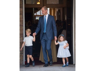 LONDON, ENGLAND - JULY 09: Prince William, Duke of Cambridge with Prince George and Princess Charlotte depart after attending Prince Louis' christening at the Chapel Royal, St James's Palace on July 09, 2018 in London, England.