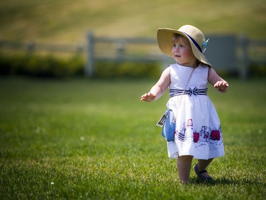 22-month-old Alma Regan wore her perfect dress and lovely hat for the Polo in the Park event.