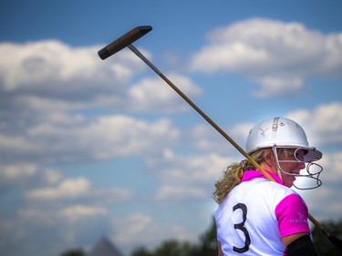 Polo players get prepared to hit the field.