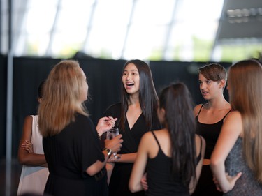 Models speak with Angie Sakla Seymour, owner of Angie's Models & Talent International, before the fashion show kicked off.