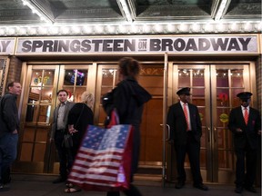 (FILES) In this file photo taken on October 3, 2017 attendees wait in front of the Walter Kerr Theater to see 'Springsteen on Broadway' in New York City.