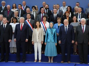 Former Canadian foreign minister John Baird and former PM Stephen Harper joined leader of the People's Mujahedin of Iran Maryam Rajavi on stage during a recent rally of the Iranian opposition in Paris. Harper has been  criticized by some for attending and speaking at the meeting.