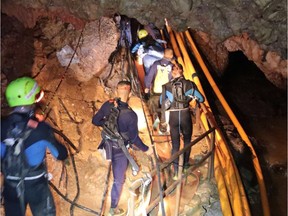 This undated handout photo taken recently and released by the Royal Thai Navy on July 7, 2018 shows a group of Thai Navy divers in Tham Luang cave during rescue operations for the 12 boys and their football team coach trapped in the cave at Khun Nam Nang Non Forest Park in the Mae Sai district of Chiang Rai province.