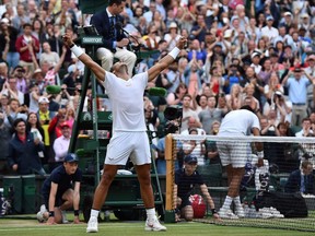 Spain's Rafael Nadal celebrates after winning against Argentina's Juan Martin del Potro during their men's singles quarter-finals match on the ninth day of the 2018 Wimbledon Championships at The All England Lawn Tennis Club in Wimbledon, southwest London, on July 11, 2018. Nadal won the match 7-5, 6-7, 4-6, 6-4, 6-4.