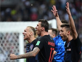 Croatia's players celebrate at the end of the Russia 2018 World Cup semi-final football match between Croatia and England at the Luzhniki Stadium in Moscow on July 11, 2018.
