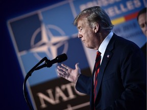 US President Donald Trump gestures as he addresses a press conference on the second day of the North Atlantic Treaty Organization (NATO) summit in Brussels on July 12, 2018.