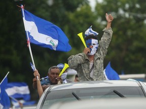 Nicaraguan demonstrators march in cars and motorcycles from Managua to Ticuantepe, 15km south of Managua, demanding the resignation of President Daniel Ortega and the end of the state repression, on July 15, 2018. More than 280 people have been killed since the start of a popular uprising against Nicaraguan President Daniel Ortega in April 18.