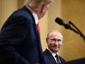 Donald Trump and Russia's President Vladimir Putin attend a joint press conference after a meeting at the Presidential Palace in Helsinki, on July 16, 2018.