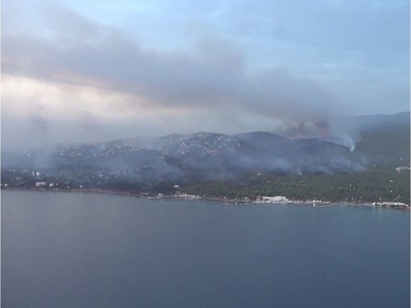 This handout picture released by the Hellenic Ministry of Defence on July 24, 2018 shows an aerial view of the fire in Mati.