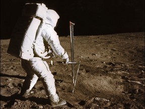 (FILES) This file photo taken on July 21, 1969 shows a photo taken by astronaut Neil A. Armstrong of the astronaut Edwin E. Aldrin conducting experiment on the moon's surface, during the Apollo XI space mission.