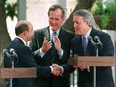 Mexican President Carlos Salinas (L) shakes hands with Canadian Prime Minister Brian Mulroney (R) as U.S. President George H.W. Bush looks on (C) after the three leaders made remarks at the signing ceremony for the North American Free Trade Agreement (NAFTA),in San Antonio (Texas) on Oct. 7, 1992. The Liberal government of Jean Chrétien kept free trade on track.