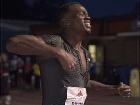 Aaron Brown celebrates after winning the 100-metre final at the Terry Fox Athletic Facility on Friday night.