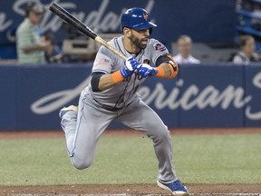 New York Mets' Jose Bautista dances away from an inside pitch in the sixth inning of their interleague MLB baseball game against the Blue Jays in Toronto on Wednesday, July 4, 2018.