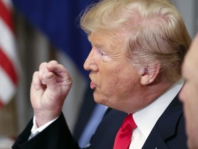 U.S. President Donald Trump gestures while speaking to NATO Secretary General Jens Stoltenberg during their bilateral breakfast, Wednesday, July 11, 2018 in Brussels, Belgium.