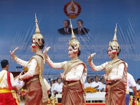 FILE - In this Saturday, July 7, 2018, file photo, dancers perform during a campaign rally of Cambodian Prime Minister Hun Sen's Cambodian People's Party in Phnom Penh, Cambodia. Cambodians voting in the general election on Sunday, July 29, will have a nominal choice of 20 parties but in reality, only two serious options: extend Prime Minister Hun Sen's 33 years in power or not vote at all.