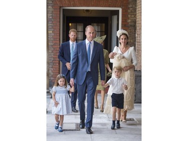 Princess Charlotte and Prince George hold the hands of their father Prince William while Kate, Duchess of Cambridge holds Prince Louis as they arrive for his christening service at the Chapel Royal, St James's Palace, London, Monday, July 9, 2018. (Dominic Lipinski/Pool Photo via AP) ORG XMIT: LLT115