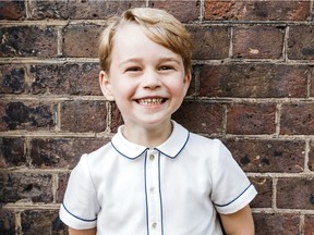 In this photo taken on Monday, July 9, 2018, Britain's Prince George poses for a picture following the christening of his brother Prince Louis, at Clarence House in London. Britain's Prince William and Kate, Duchess of Cambridge have released a photo of Prince George to mark his fifth birthday on Sunday, July 22.