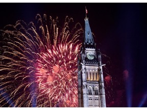 Fireworks explode over the Peace Tower on Parliament Hill at the end of Canada Day celebrations, in Ottawa on Sunday, July 1, 2018.