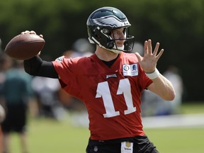 In this June 7, 2018, photo, Philadelphia Eagles' Carson Wentz runs a drill during an organized team activity at the NFL football team's practice facility in Philadelphia. Wentz and his longtime girlfriend Maddie Oberg were wed at the Lake House Inn in Bucks County on Sunday, July 15, and kayakers and canoers on Lake Nockamixon were treated to a waterside view of the nuptials.