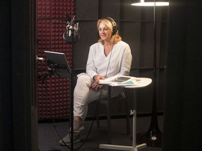 Author Debbie Travis prepares to record a passage from her book at her publisher's studio, in Toronto on Thursday, July 19, 2018.