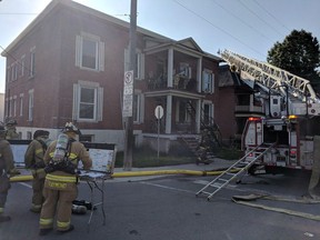 Ottawa firefighters at the scene of two-alarm fire at 135 Concord Street South on July 2, 2018