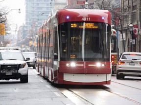 A police car is stopped as traffic moves along the street on November 13, 2017. A Bombardier executive says he is truly apologetic for the latest problems with the streetcars his company recently delivered to the Toronto Transit Commission.Appearing before a TTC meeting at City Hall on Tuesday, Benoit Broissoit, president of Bombardier Transportation for the Americas says Bombardier understands and shares the disappointment.