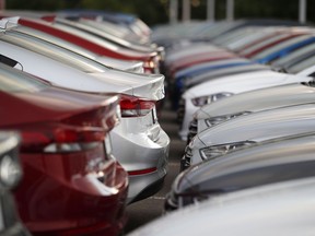 In this Sunday, June 24, 2018, photograph, unsold 2018 Elantra sedans sit at a Hyundai dealership in Littleton, Colo. An automotive study says U.S. tariffs on imported vehicles and auto parts would cause the price of new vehicles to soar, wipe out tens of thousands of American jobs and take a big chunk out of the country's gross domestic product.