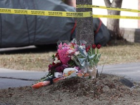 Flowers are seen outside a home in Ajax, Ont., on Thursday, March 15, 2018. A woman and her two children were killed in the house, leading to three second-degree murder charges against 29-year-old Cory Fenn, who was remanded in custody. A group that tracks media reports of the killing of women and girls says there were 78 victims of femicide across Canada in the first half of this year. A report from the Canadian Femicide Observatory for Justice and Accountability lists the victims by age, location and name, where possible.