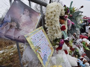 A makeshift memorial of toys and flowers sits outside the investigation area in the murder case of Cedrika Provencher Thursday, December 17, 2015 in Saint Maurice, Que. Court documents show Quebec provincial police went to great lengths to lure a man they considered a key suspect in the disappearance of a young girl in 2007. For more than eight years, Cedrika Provencher's face was plastered on posters across the province. There were rumours and claims of sightings, a massive manhunt and heartfelt appeals for information from the family that didn't pan out.