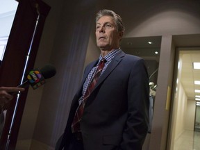 Hamilton Mayor Fred Eisenberger is interviewed by a television station as he attends the Big Cities summit hosted by the Federation of Canadian Municipalities in Toronto on Thursday, February 5 2015. A unilateral decision by Premier Doug Ford to slash the size of Toronto's city council in half has dismayed at least one other big city mayor in Ontario.THE CANADIAN PRESS/Chris Young