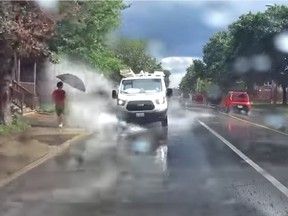 A dashcam video from another vehicle catches a truck splashing a pedestrian on King Edward Avenue on Friday. Saif Khan/YouTube