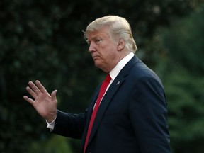 President Donald Trump waves after stepping off Marine One on the South Lawn of the White House, Thursday, July 26, 2018, in Washington. Trump is returning from a trip to Iowa and Illinois.