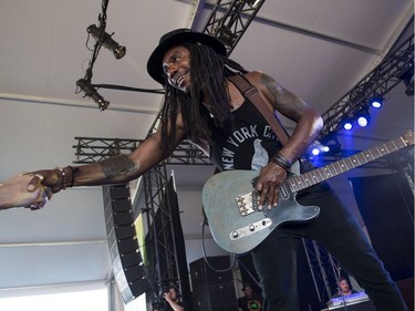 Julian Taylor from The Julian Taylor Band shake hands with an audience as they perform at the Claridge Homes stage on the last day of Bluesfest in Ottawa on July 15, 2018.