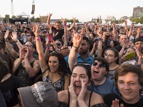 Spectators react to the Canadian rock band Three Days Grace as they perform on the City Stage on the final day of RBC Ottawa Bluesfest on Sunday. In total, about 10,000 passholders for Bluesfest in 2018 were under the age of 25.