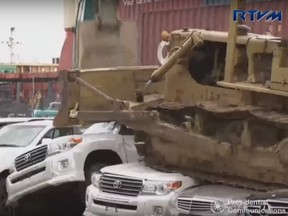 A still image taken from video shows a bulldozer destroying vehicles in Port Irene, Philippines.