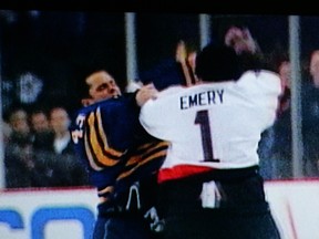 Senators G Ray Emery and Buffalo Sabres counterpart Martin Biron fight (and get ejected from the game) after Chris Neil's hit on Chris Drury ignites full-scale brawl.