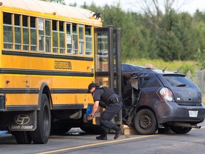 Ottawa police on scene of an apparent fatal accident between a bus carrying school children and a van at the corner of March Valley Rd and Klondike Rd in Kanata. This view is from the corner of Klondike looking east along March Valley Rd to where the bus and car are located, about 30 metres from the corner. Reports suggest the fatality was the van driver and that the children only received minor injuries if at all.