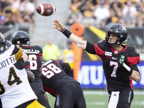 Ottawa Redblacks Trevor Harris throws during second half CFL football game action against the Hamilton Tiger-Cats in Hamilton, Ont. on Saturday, July 28, 2018.